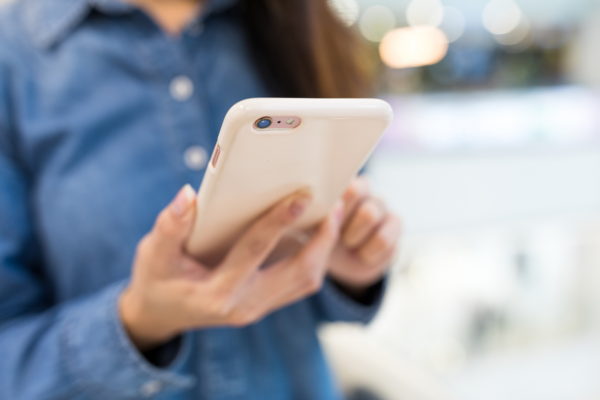 Cell Phone Insurance | Women Holding White Cellphone | MiSure